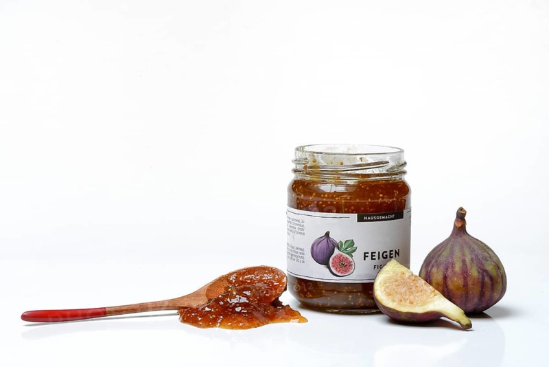 Fig jam in a jar and spoon with fig jam, fresh figs, Ficus carica