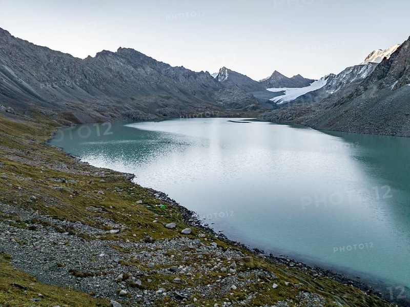 Mountains with glacier, mountain pass and mountain lake Ala-Kul Lake, Tien Shan, Kyrgyzstan, Asia