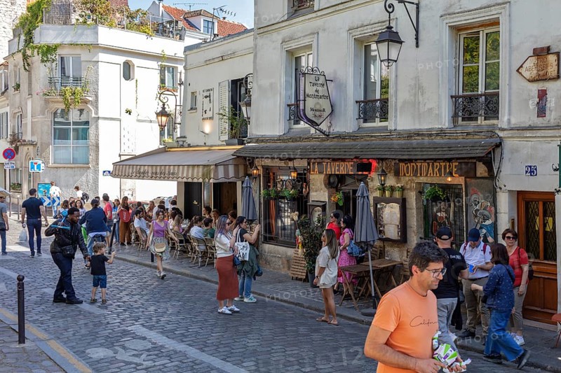 A lively café area in Montmartre, Paris with lots of people, Paris