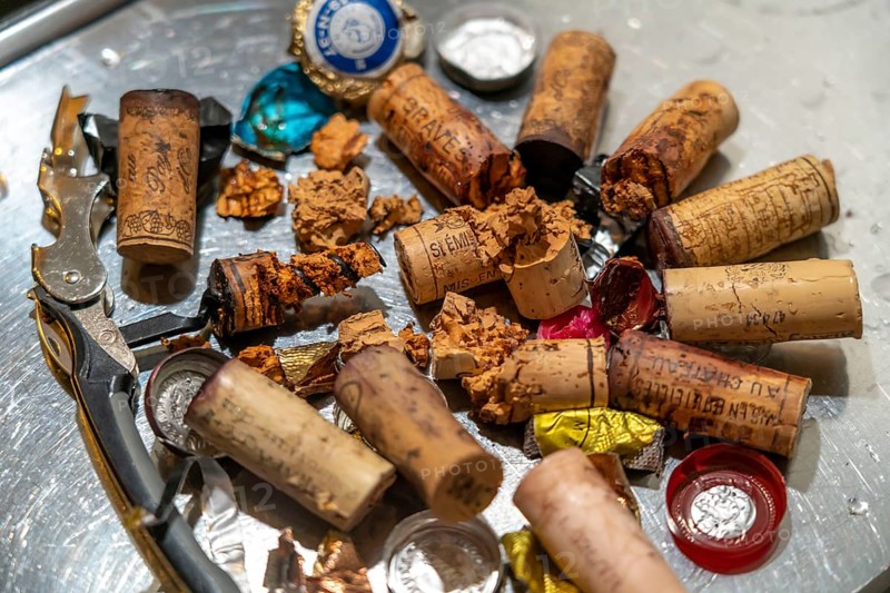 Wine cork, extracted from old, overaged wine bottles, partly crumbly, softened, rotten