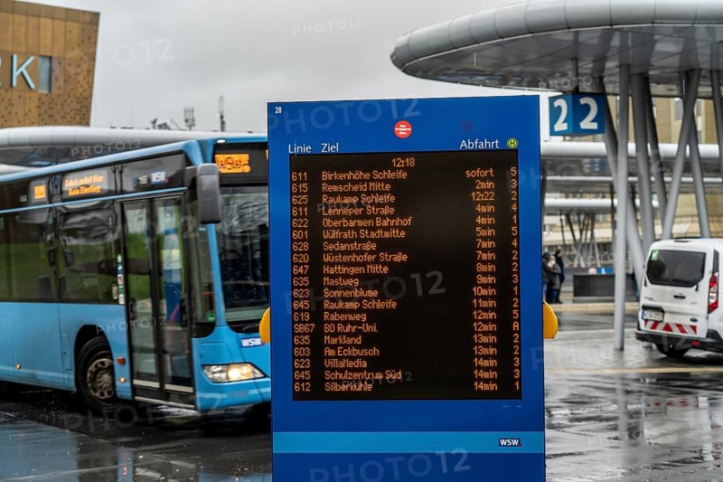 Digital timetable, display board, at the central bus station, WSW buses, at the main railway station, Wuppertal, North Rhine-Westphalia, Germany, Europe