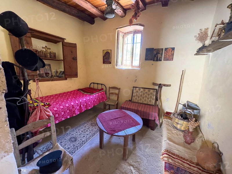 For visitors of Odigitria Monastery historical furnished monk's cell monastery cell furnished in Unesco Site site orthodox Greek Orthodox Monastery Moni Odigitria, Festos, Crete, Greece, Europe