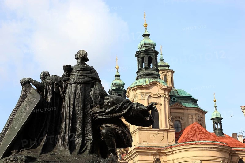 Jan Hus Monument on Old Town Square and the baroque St Nicholas Church, Prague, Czech Republic, Europe
