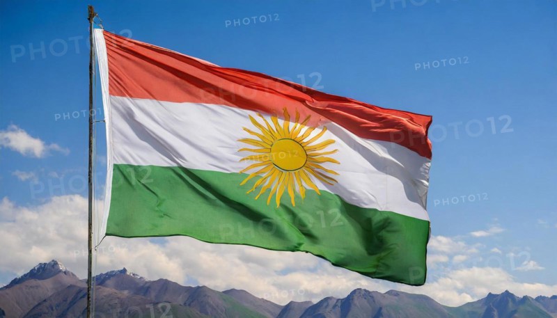 The flag of Kurdistan flutters in the wind