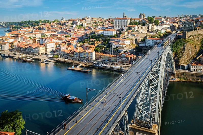 View of Porto city and Douro river and Dom Luis bridge I with metro tram from famous tourist viewpoint Miradouro da Serra do Pilar. Porto, Vila Nova de Gaia, Portugal, Europe