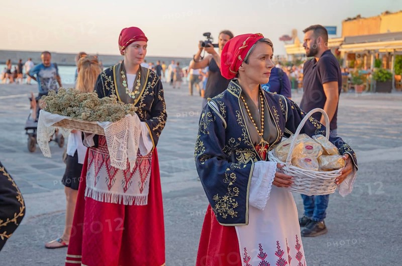Traditionally dressed Greek women carrying gifts during marriage celebration, Chania, Crete, Greek Islands, Greece, Europe