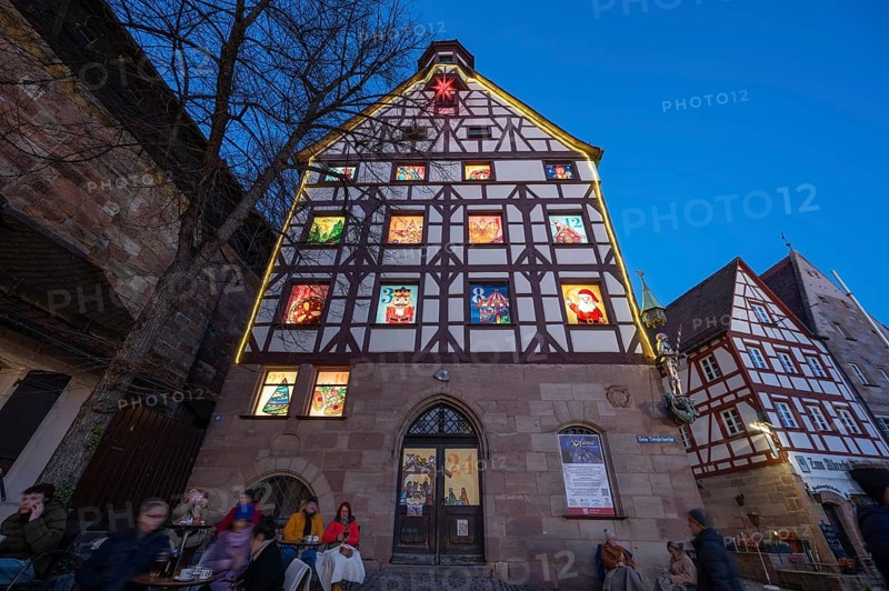 Main façade of the historic Pilatushaus with an Advent calendar designed by the Altstadtfreuden Nürnberg, Tiegärtnertorplatz, Nuremberg, Middle Franconia, Bavaria, Germany, Europe