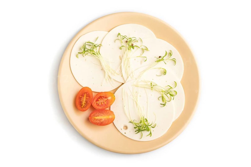 White cheese with tomatoes and cilantro microgreen isolated on white background. top view, flat lay, close up