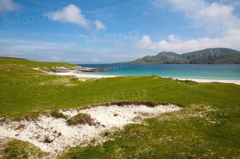 Machair grassland and sandy beach at Bagh a Deas, South Bay, Vatersay island, Barra, Outer Hebrides, Scotland, UK