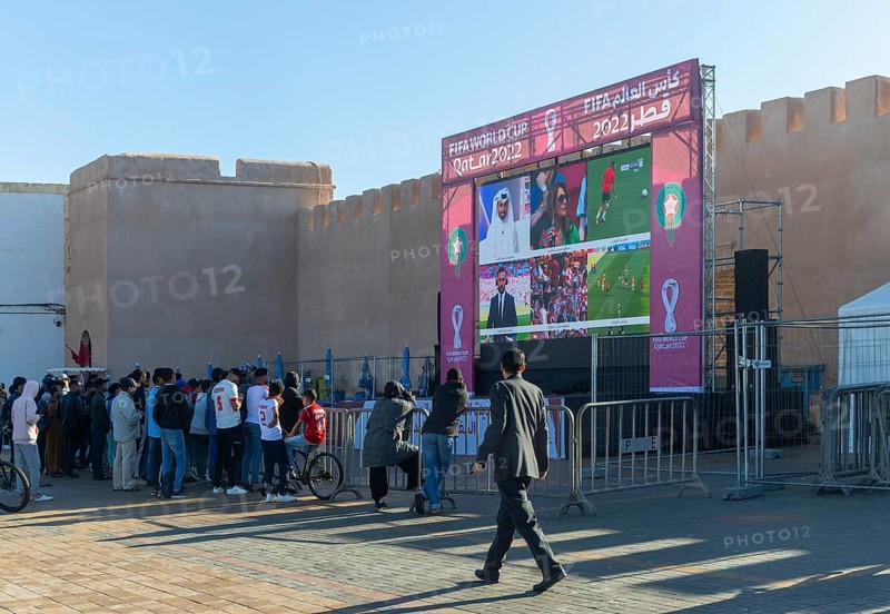 Crowd watching big screen football match FIFA World Cup, Qatar 2022, Essaouira, Morocco, north Africa, Africa