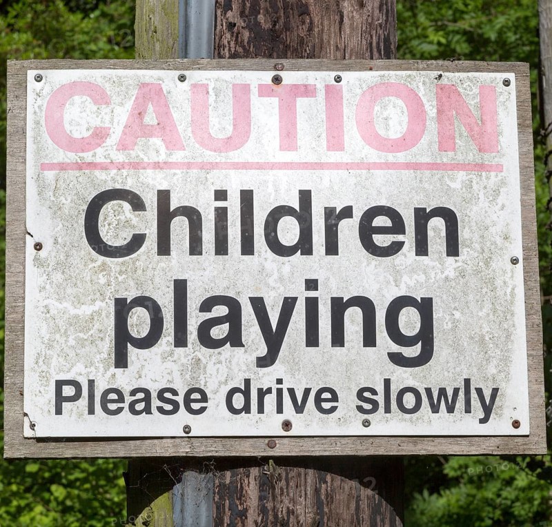 Caution children playing road sign, England, UK