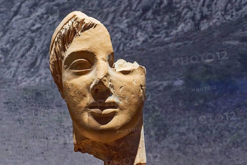 Fragment of an ancient bust with a prominent half of the face, damaged, Archaeological Museum, Archea Korinthos, Corinth, Peloponnese, Greece, Europe