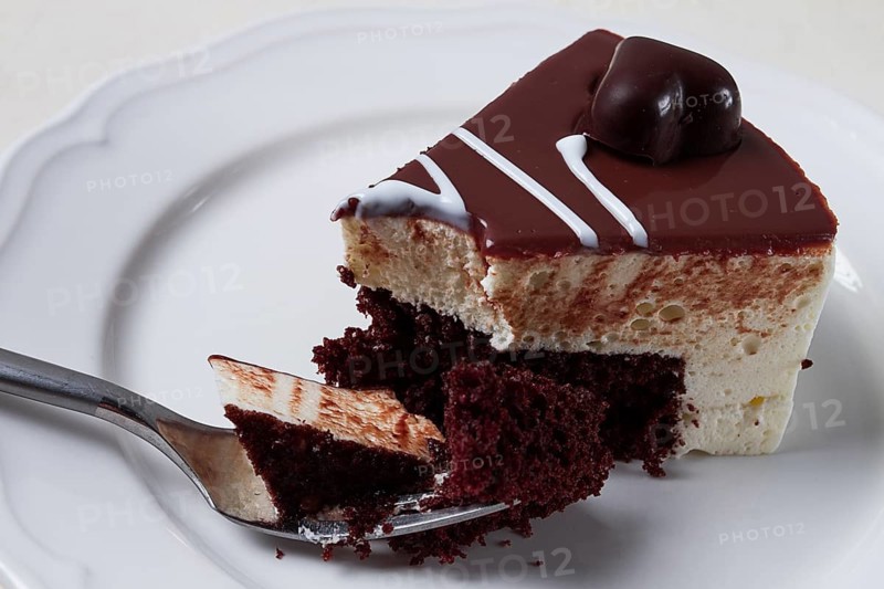 Slice of cake, bird's milk, chocolate sponge cake with souffle, sweet dessert, on a white plate, close-up, horizontal, no people