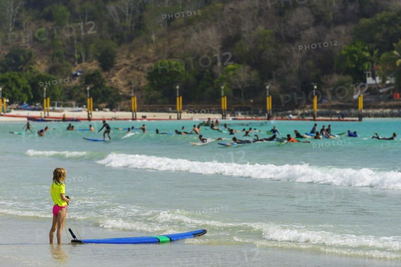 Girl on the beach in a surf school, water sports, beach, sea, ocean, sport, holiday, travel, tourism, childhood, learning, summer holiday, family holiday, water, summer, sun, Bali, Indonesia, Asia