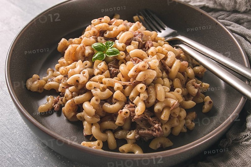 Pasta with stewed meat, pasta in the navy, horns, homemade, no people