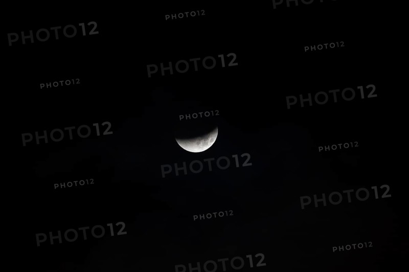 The moon with a partial lunar eclipse, taken in the Swiss mountains, Switzerland, Europe