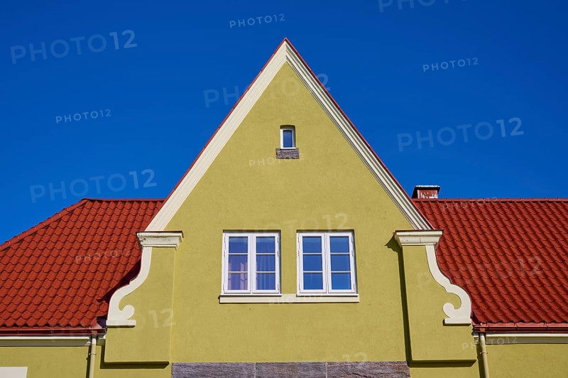 House gable with red tiled roof and white windows against a clear blue sky, Molde, Romsdal, Norway, Europe