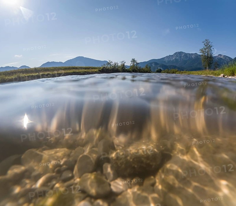 Underwater photograph of a river in front of mountains in sunlight, summer, Loisach, Schlehdorf, Alpine foothills, Bavaria, Germany, Europe