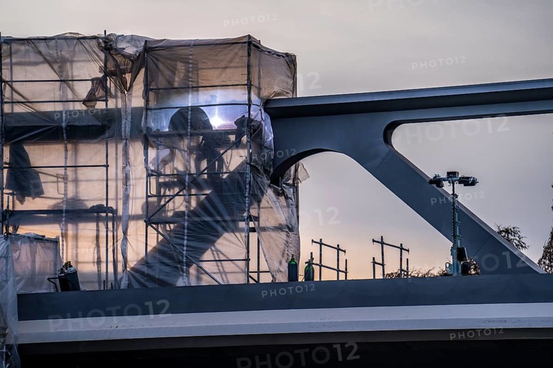 Welding work, during the construction of a 480 metre long bridge for the new U81 light rail line, over the Nordsternkreuz, over the A44 and the B8 at Düsseldorf Airport, the bridge sections are moved on 5 piers using the incremental launching method after assembly, North Rhine-Westphalia, Germany, Europe