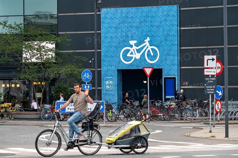Cyclists on cycle paths, bicycle parking garage at the Fisketorvet shopping centre, Sydhavnen, in the city centre of Copenhagen, is considered the bicycle capital of the world, 45 % of the inhabitants travel by bicycle, Denmark, Europe