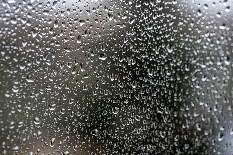 Rainy weather, raindrops on a window pane