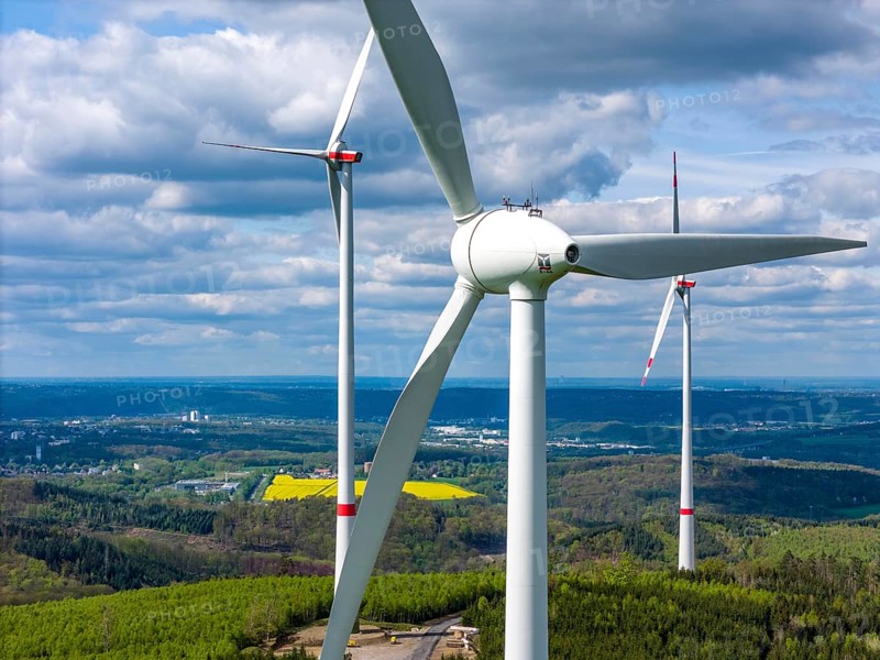 Erection of a wind turbine, wind energy plant, assembly of the ring generator, with a crawler lattice crane, wind farm near Hagen, North Rhine-Westphalia, Germany, Europe