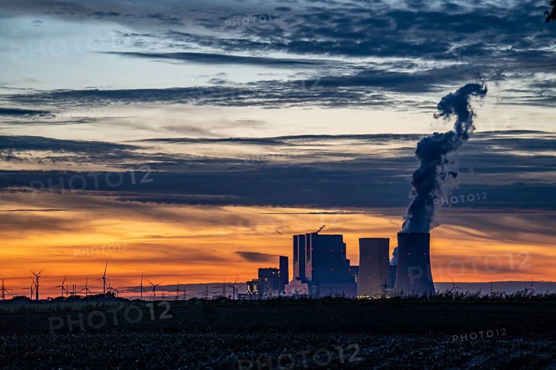 The RWE lignite-fired power plant Neurath, near Grevenbroich, largest German coal-fired power plant, second largest in Europe, Block F-G, wind farm, sunset, North Rhine-Westphalia, Germany, Europe