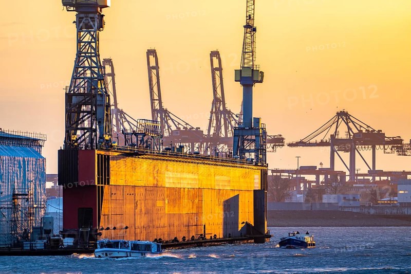 Port of Hamburg, view of the Blohm + Voss shipyard, Dock 11, evening, cranes of the container terminals, Hamburg Germany