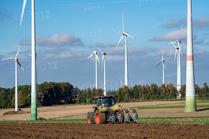 Farmer working in the fields, with a tractor, wind farm above the village of Lichtenau, self-proclaimed energy town, Paderborn district, OWL, A North Rhine-Westphalia, Germany, Europe