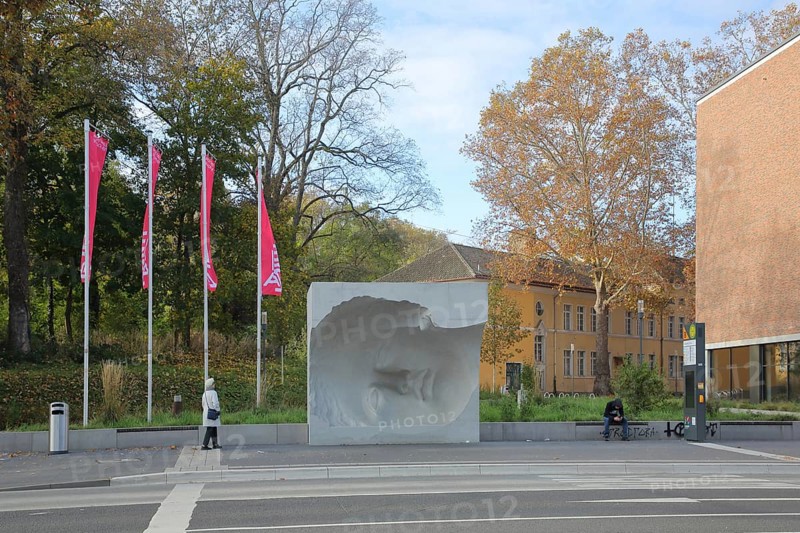 Sculpture Head of Roman Goddess by Jonathan Banz 2021, bus stop LEIZA, public transport, hollow form, curved, concave, lying, face, oversize, concrete, Mainz, Rhine-Hesse region, Rhineland-Palatinate, Germany, Europe