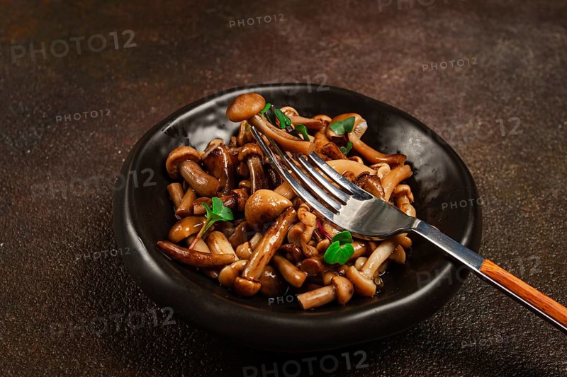 Pickled honey mushrooms, in a bowl, homemade, top view, no people