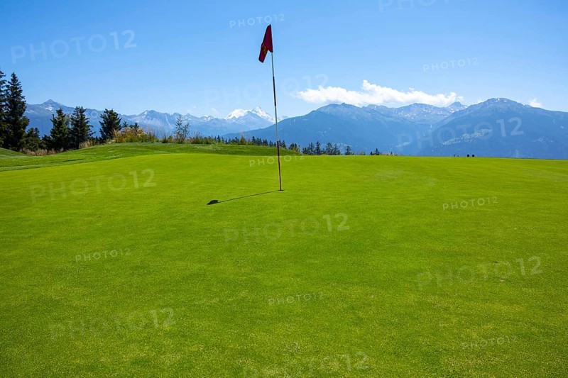 Crans Sur Sierre Golf Course with Hole 7 and Mountain View in Crans Montana in Valais, Switzerland, Europe
