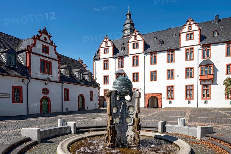 Hadamar Castle, Renaissance residence, on the left farm building with town museum, glass museum, fountain for displaced persons from Bohemia, castle square, old town centre, Hadamar, Limburg-Weilburg, Westerwald, Hesse, Germany, Europe