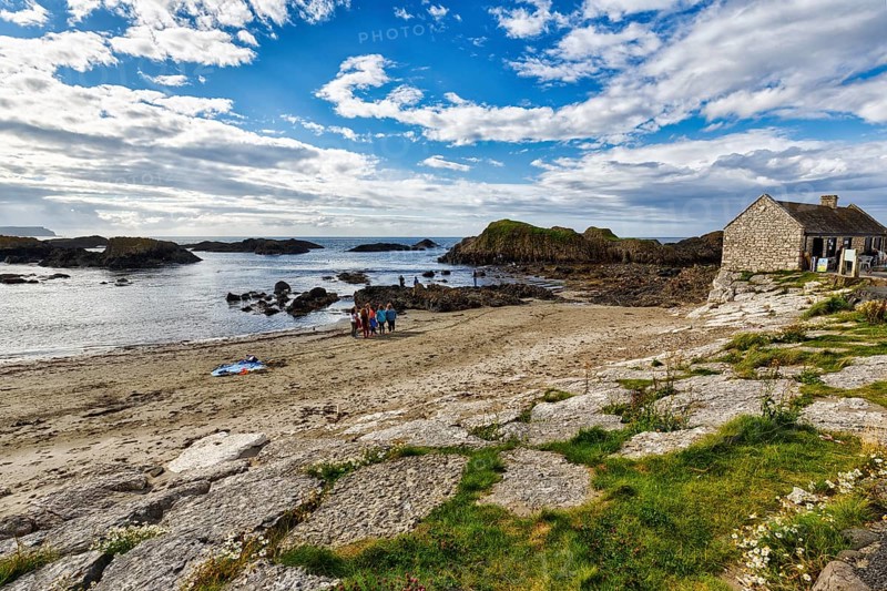 Rocky coast with narrow sandy beach, Ballintoy Harbour, Causeway Coastal Route, Antrim, Northern Ireland, Great Britain