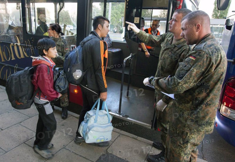 Syrian refugees arrive at Schönefeld station on a special train. They are then taken by bus to accommodation in Berlin, 01.10.2015