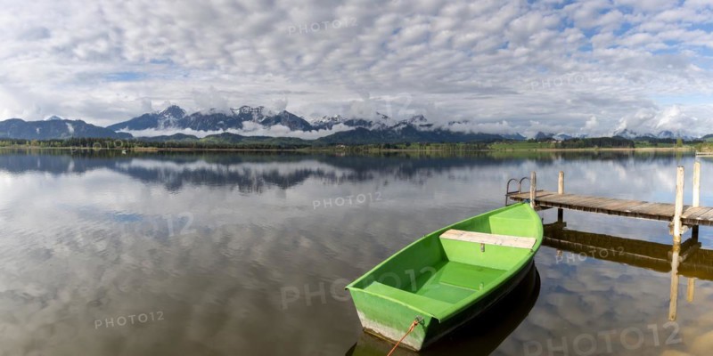 Rowing boat at sunrise, Hopfensee, Hopfen am See, near Füssen, Ostallgäu, Allgäu, Bavaria, Germany, Europe