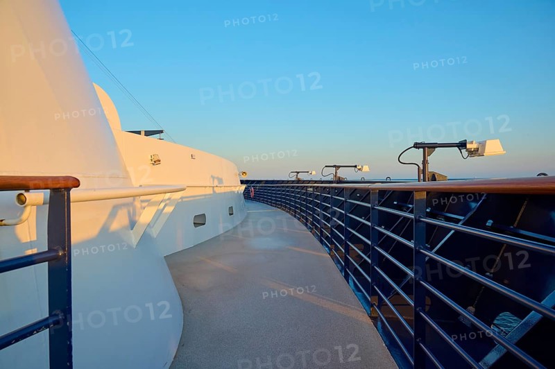 Deck of a cruise ship with clear blue sky and blue railing, Mein Schiff 6, North Sea, Denmark, Europe
