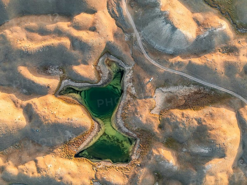 Green lakes between golden hills with gravel road, top down shot, aerial view, Trans Alay Mountains, Pamir Mountains, Osher Province, Kyrgyzstan, Asia