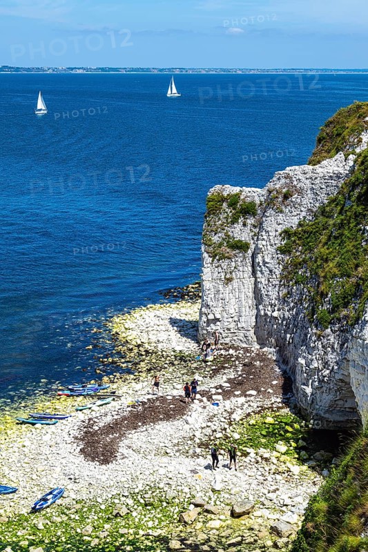 People on paddleboards, White Cliffs. Old Harry Rocks Jurassic Coast, Dorset Coast, Poole, England, United Kingdom, Europe