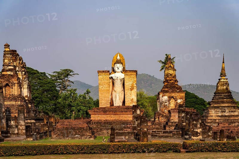 Giant standing Buddha in the Wat Mahathat temple in the UNESCO World Heritage Sukhothai Historical Park, Thailand, Asia