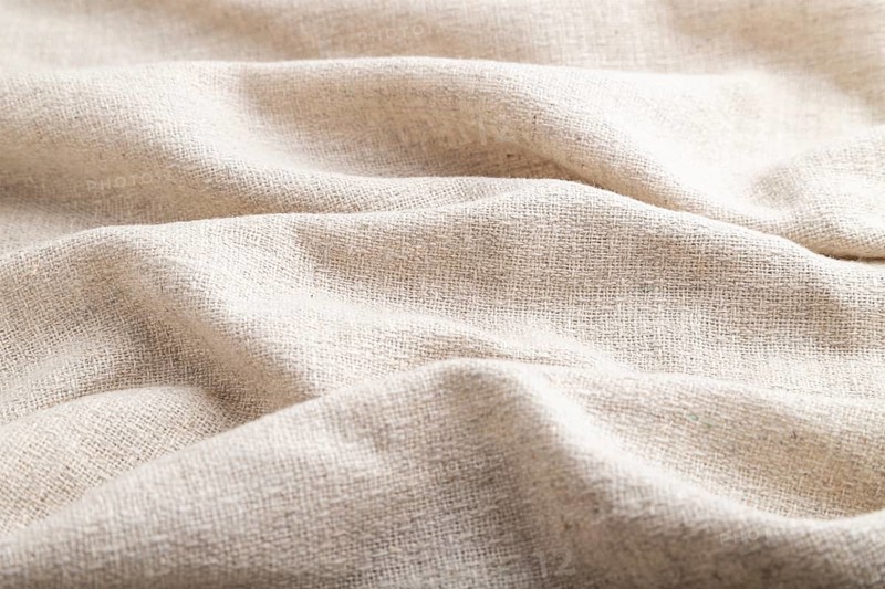 Fragment of white linen tissue. Side view, natural textile background and texture. wave concept, abstract