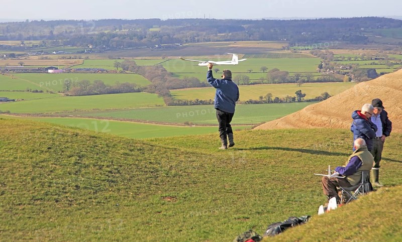 Flying model airplanes from Roundway Down, North Wessex Downs, Wiltshire, England, UK