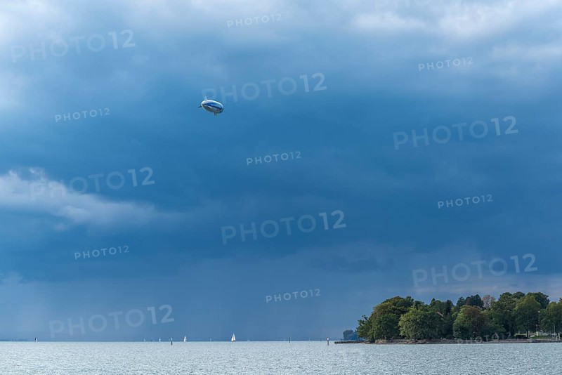 Moated castle, Lake Constance, Zeppelin, dinkle clouds, sailboats, forest, Bavaria, Germany, Europe