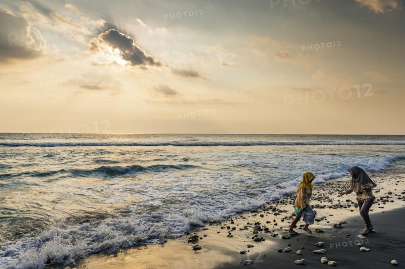 Muslim woman in the evening sun at Mangsit beach in Sengiggi, Islam, religion, headscarf, travel, tourism, sea, beach, water, respect, dramatic, drama, emotion, play, joy, surf, surf, ocean, island, coast, tropical, tropics, Asian, natural landscape, untouched, tourism, holiday, lonely, deserted, calm, authentic, authenticity, original, atmosphere, holiday mood, long-distance travel, tradition, traditional, poverty, culture, tradition, holiday idyll, Lombok, Indonesia, Asia