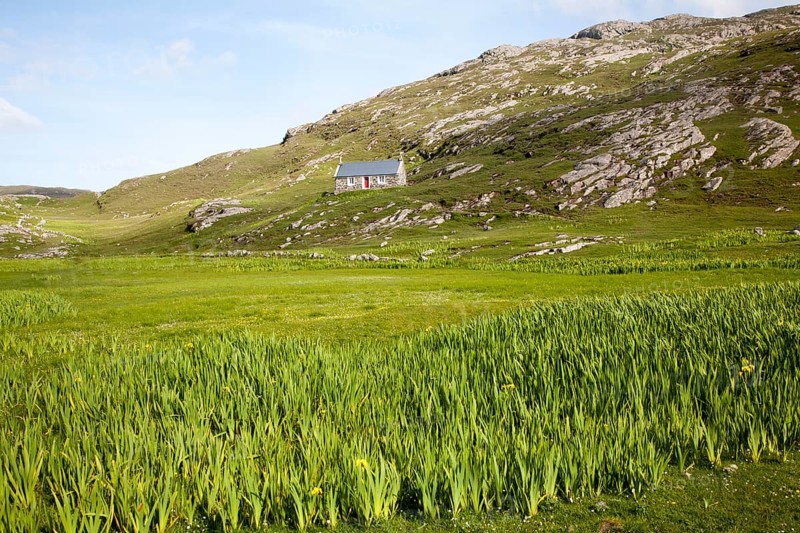 Small boffey building in rocky setting, at Allathasdal, Barra, Outer Hebrides, Scotland, UK