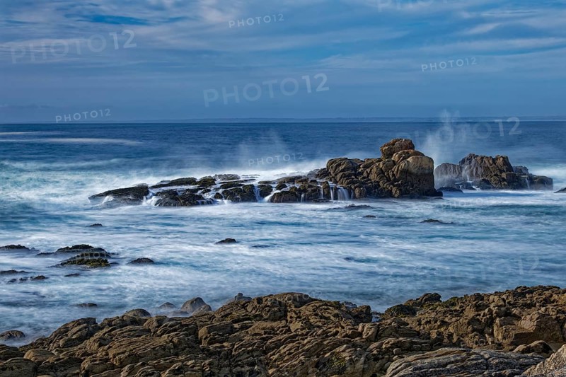 The waves of the Atlantic wash over the rocks on the coast off Penmarch in Brittany. Finistere, France, Europe