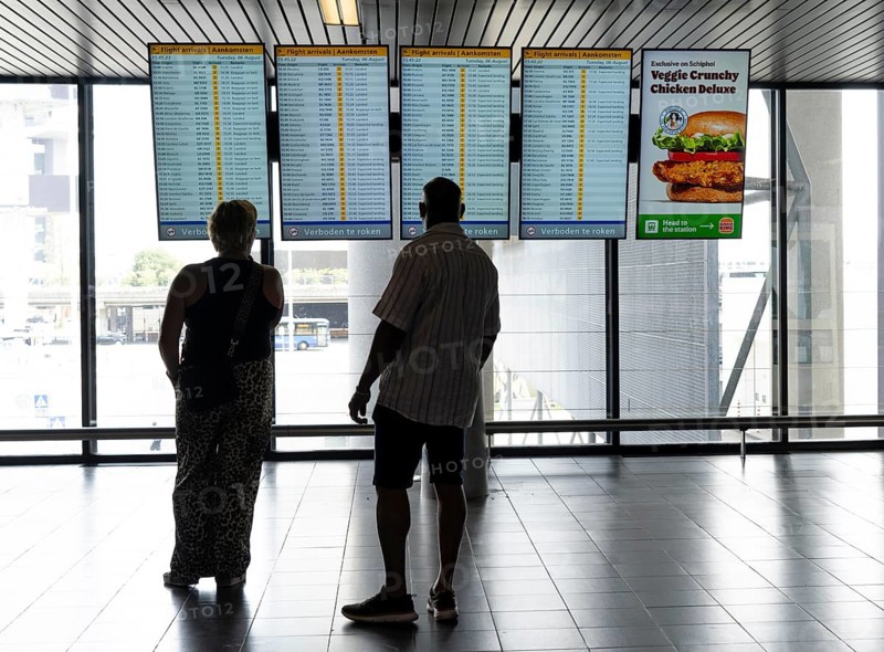 Info screens for departures, arrivals at Amsterdam Schiphol Airport, Terminal, Netherlands