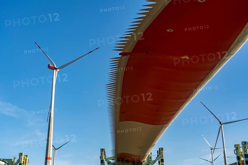 Wind farm near Bad Wünnenberg, construction site, toothing on the rotor blades, so-called Enevoldsen or Dinotails, are intended to reduce the noise of the rotors, storage area for a new wind turbine, components of the mast, the nacelle and the rotors are ready for assembly, North Rhine-Westphalia, Germany, Europe