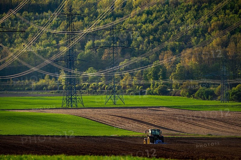Tractor working a field near Grevenbroich, in spring, Germany, Europe