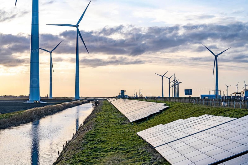 Solar park on the Slaperdijk dyke near the Eemshaven, test project, 17, 000 solar modules were installed over a good 5 kilometres, the Netherlands has over 22, 000 kilometres of dyke line, here it is being tested whether such an installation is successful and can be expanded, wind farm, Groningen, Netherlands